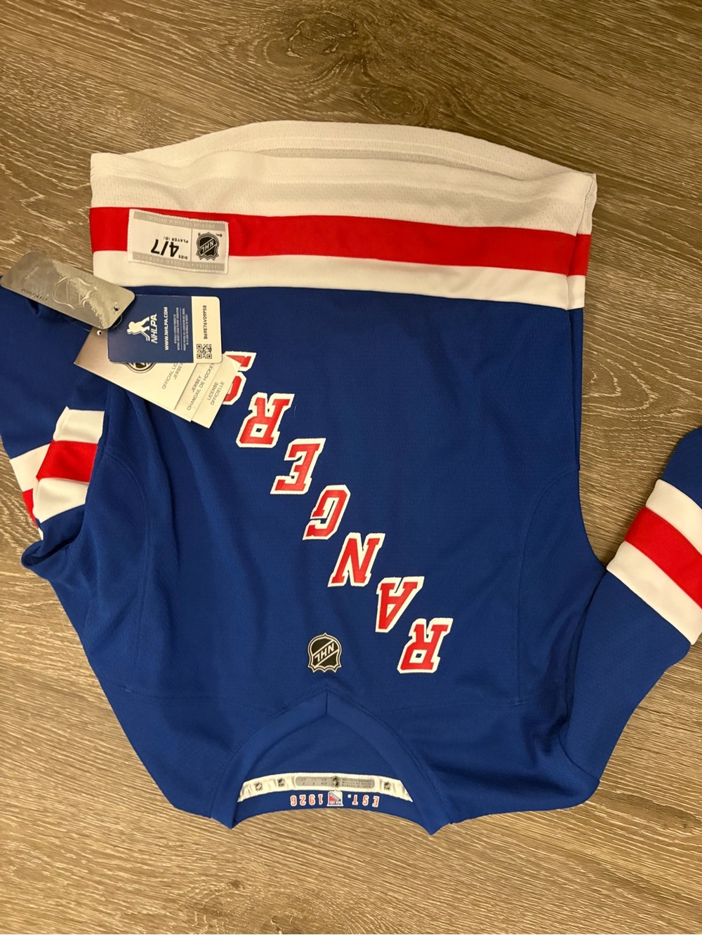 NHL Blue Jersey with Red and White Accents - NHL Brand